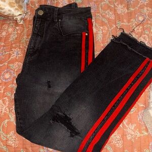 Black ripped jeans with red stripes down the side. Brand: Tinseltown Size: 25